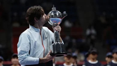 a person kissing a trophy