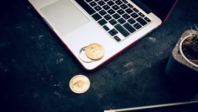 a laptop with coins on it